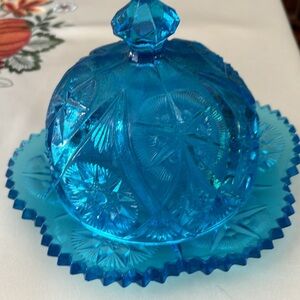 Beautiful Vintage blue butter dish. It is a star pattern with beautiful details.